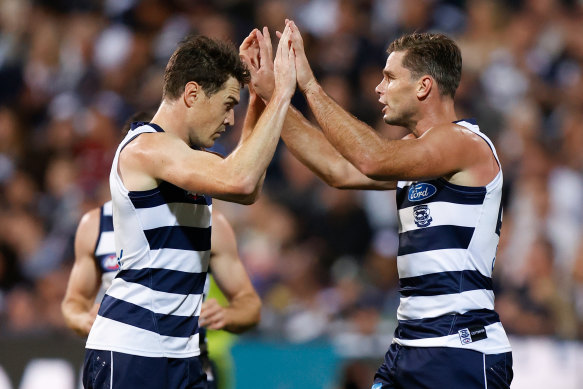 Jeremy Cameron and Tom Hawkins celebrate a goal.