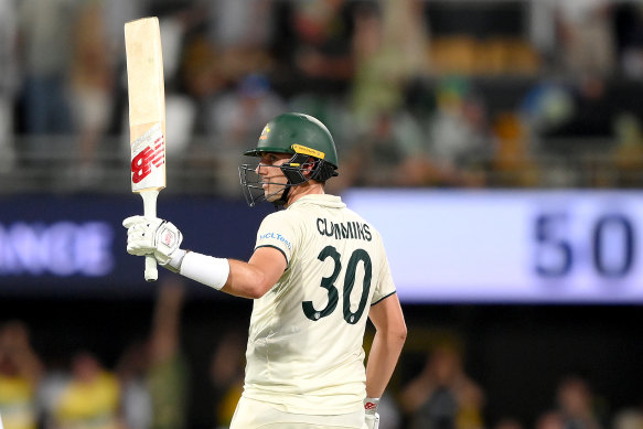 Pat Cummins celebrates his half-century.