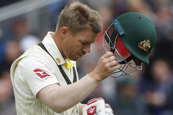 Warner leaves the field after being dismissed in Manchester.