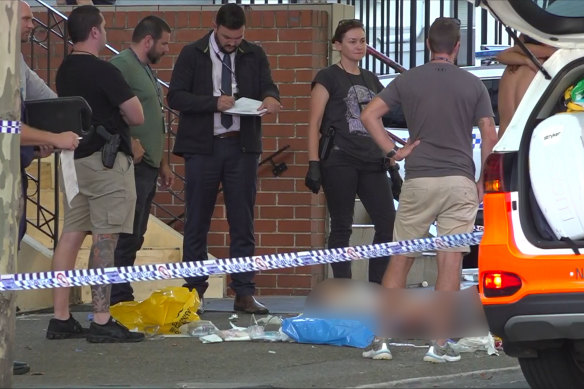 Police at the crime scene outside Blacktown Police Station.