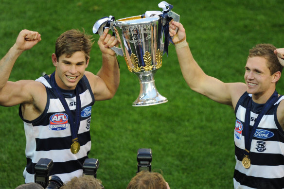 Tom Hawkins and Joel Selwood after the 2011 grand final.