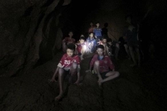 A photo released by Tham Luang Rescue Operation Centre during the rescue mission that shows the boys and their soccer coach as they were found in a partially flooded cave in Thailand.