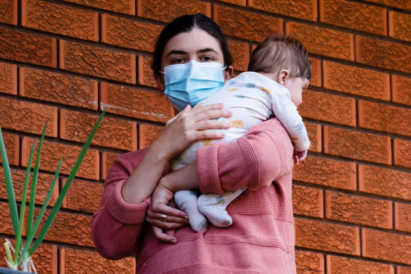 Jaclyn Hooper, who did not apply for a postal vote, with her baby.