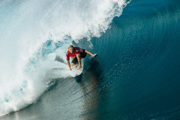 Ethan Ewing charges through a Teahupo’o barrel.