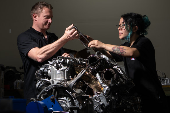 CMR Automotive owner Cameron Virtue, pictured with apprentice mechanic Xanthe Ba-Pe, works up to 80 hours a week to cover staffing gaps at his two garages in Sydney’s inner west.