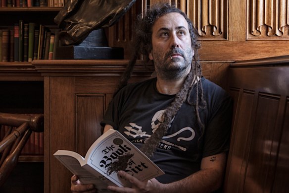 Bram Presser with his award-winning debut novel, The Book of Dirt, in 2018.