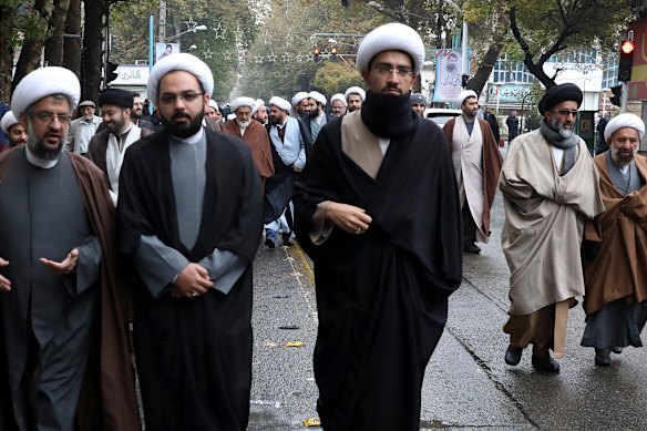 Clerics at a funeral for a Revolutionary Guard member who was killed in the protests.