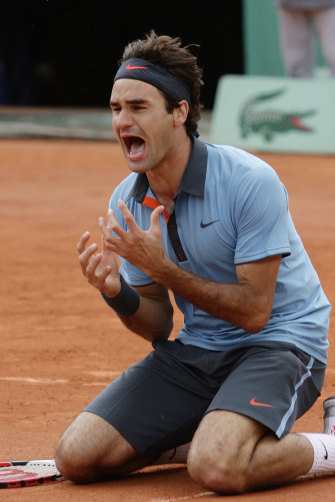Federer's jubilation is clear as he finally wins the elusive French Open in 2009. 