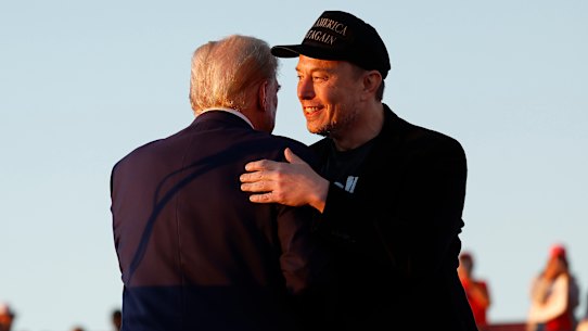 Elon Musk embraces Donald Trump during a campaign rally in October.