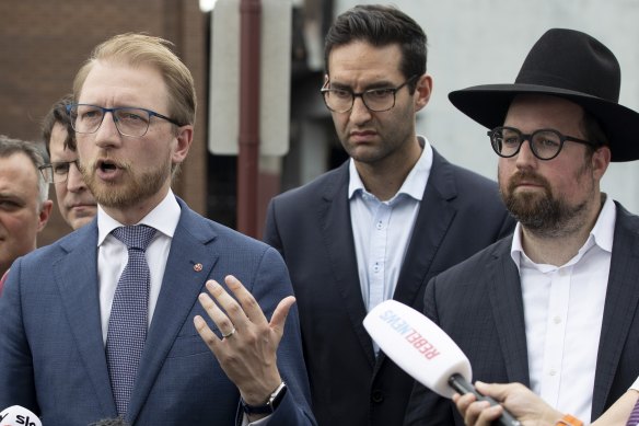 Josh Burns (centre right) claims James Paterson (speaking) agreed to read out his words before Peter Dutton intervened.