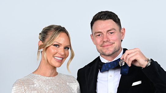 Lachie Neale and wife Jules pose for portraits after he was awarded the 2023 Brownlow Medal.