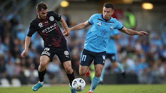 SYDNEY, AUSTRALIA - APRIL 10: Kosta Barbarouses of Sydney FC competes for the ball against Benjamin Garuccio of Melbourne City during the A-League match between Sydney FC and Melbourne City FC at Leichhardt Oval, on April 10, 2021, in Sydney, Australia. (Photo by Matt King/Getty Images)