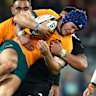 WELLINGTON, NEW ZEALAND - SEPTEMBER 28: Josh Flook of Australia is tackled during The Rugby Championship & Bledisloe Cup match between New Zealand All Blacks and Australia Wallabies at Sky Stadium on September 28, 2024 in Wellington, New Zealand. (Photo by Phil Walter/Getty Images)
