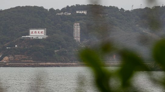 A billboard with a message reminding people to be ready to fight is seen on the Taiwanese island of Mazu that is close to Fujian, China.