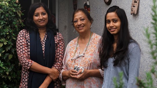 Priya Pillai, Devleena Ghosh and Dola Baswas outside their home.