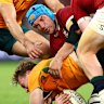 BRISBANE, AUSTRALIA - JULY 19: Harry Potter of the Wallabies is tackled by Tadhg Beirne and Tommy Freeman of the British and Irish Lions during game one of the series between Australia Wallabies and British & Irish Lions at Suncorp Stadium on July 19, 2025 in Brisbane, Australia. (Photo by Chris Hyde/Getty Images)