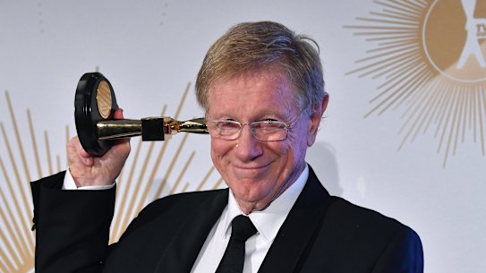 Kerry O'Brien poses with his Logie after being inducted into the Hall of Fame.
