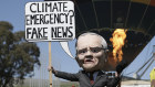 A climate change rally is held on the front lawn of Parliament House on Tuesday as the a motion to declare a climate emergency was voted down. 