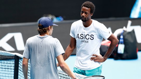 Gael Monfils and Alex de Minaur are free to mingle on the practice court on Saturday.