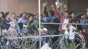 Central American migrants wait for food in a pen erected by US Customs and Border Protection to process a surge of migrant families and unaccompanied minors in El Paso, Texas, in March.