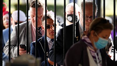 Racegoers arrive at Flemington for Melbourne Cup Day 2021.