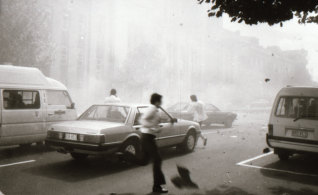 Bystanders run from the scene of the explosion.
