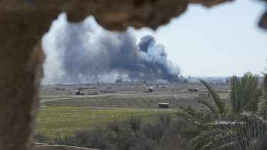 Columns of black smoke billow from the last small piece of territory held by Islamic State militants as US backed fighters pounded the area with artillery fire and occasional airstrikes in Baghouz, Syria, on Sunday.