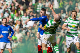 Rangers’ Ryan Kent clashes with Celtic’s Scott Brown during a combustible Old Firm derby in 2019.