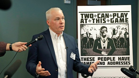 Chris Ingalls, an investigative reporter with KING-TV in Seattle, talks to reporters about the poster, reproduced at right, that was mailed to his home earlier this year.