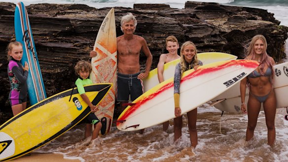Adriaan van der Wallen, centre, with surfers including Blaze Roberts (right) and Josh Leigh (yellow and white board). 