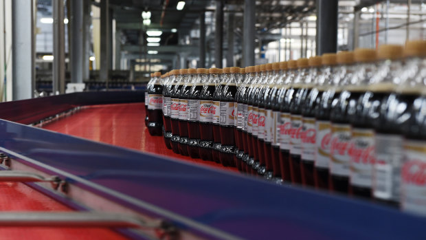 Bottles of caffeine-free Diet Coke move along a conveyor belt at a Coca-Cola Amatil production facility in Melbourne.