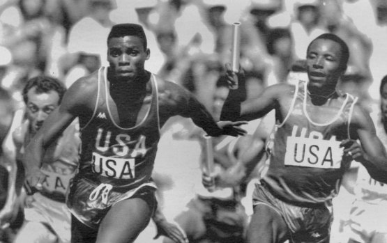 The great Carl Lewis accepts the baton from Calvin Smith at the 1984 Los Angeles Olympics