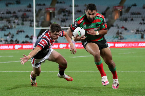 Souths winger Alex Johnston beats Kyle Flanagan to score one of his five tries.
