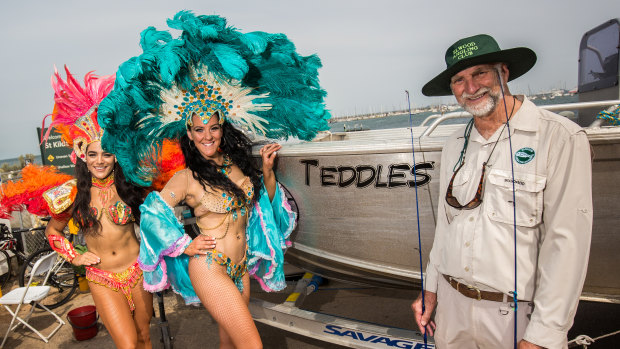 Elwood Angling Club named its boat Teddles after veteran member Ted Wilkinson (right) who posed with Latin dancers from DanceCity Productions at the St Kilda Festival.