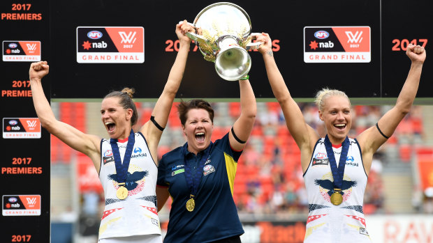 Bec Goddard, centre, led the Adelaide Crows to the inaugural AFLW title.