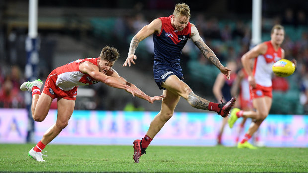 Catch me if you can: Melbourne’s James Harmes scores a goal in the win that condemned the Swans to a 1-3 start to the AFL season.