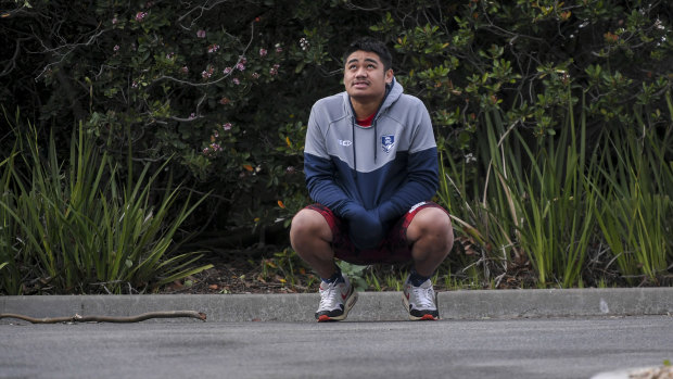 Veni Atonio prays at the scene where his friend was killed.