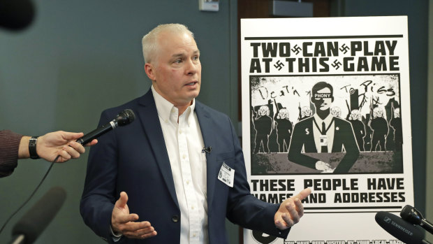 Chris Ingalls, an investigative reporter with KING-TV in Seattle, talks to reporters about the poster, reproduced at right, that was mailed to his home earlier this year.