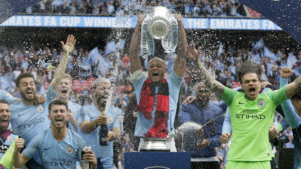 Triple treat: Manchester City capped off a sensational season in style.