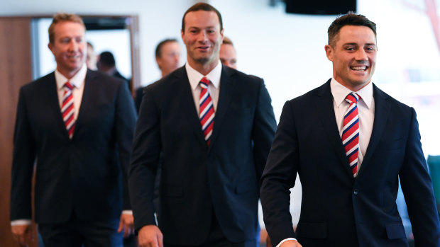 All smiles: Boyd Cordner, Trent Robinson and Cooper Cronk attend the grand final media conference on Thursday. 