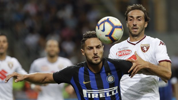 Held: Inter Milan's Danilo D'Ambrosio (left) challenges Torino's Emiliano Moretti during their Serie A draw.