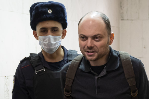 Russian opposition activist Vladimir Kara-Murza is escorted to a hearing in a court in Moscow in 2023.