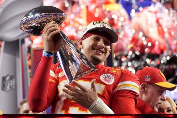 Kansas City Chiefs quarterback Patrick Mahomes with the Super Bowl LVIII trophy.