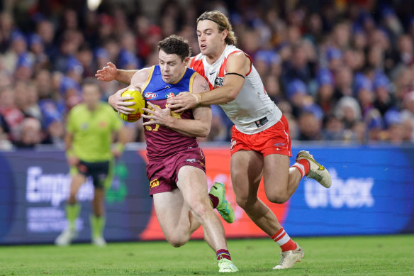 Brisbane’s Lachie Neale and James Rowbottom vie for possession.