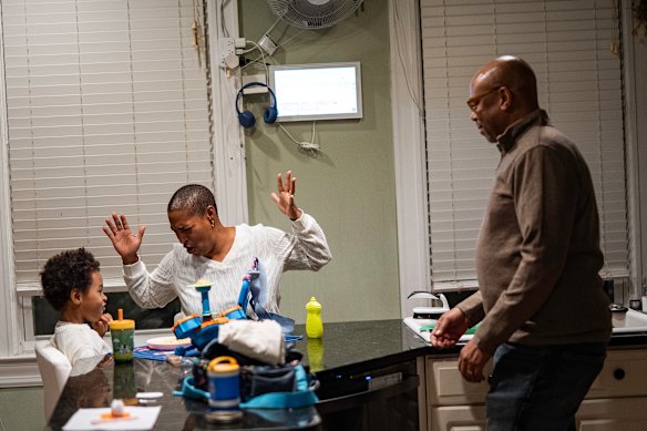 Marc and Cristina Easton with Ellis at dinner.