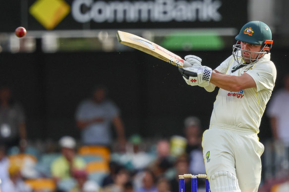 Travis Head takes to the South African bowling attack in Brisbane.