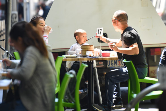 Outdoor dining tables have popped up on Bourke Street outside the Village Centre Arcade.