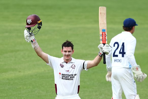 Jack Clayton celebrates a century at a Sheffield Shield match at the Gabba.