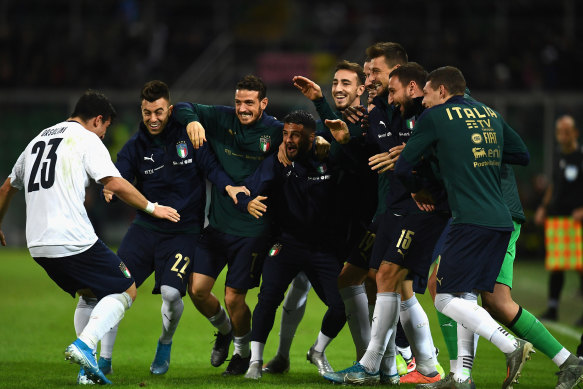 Riccardo Orsolini celebrates his goal on debut for Italy.