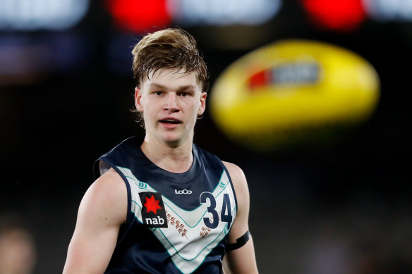 Selfless act: Max Gruzewski ran back during a 2-km time trial to help out draft pick who fell